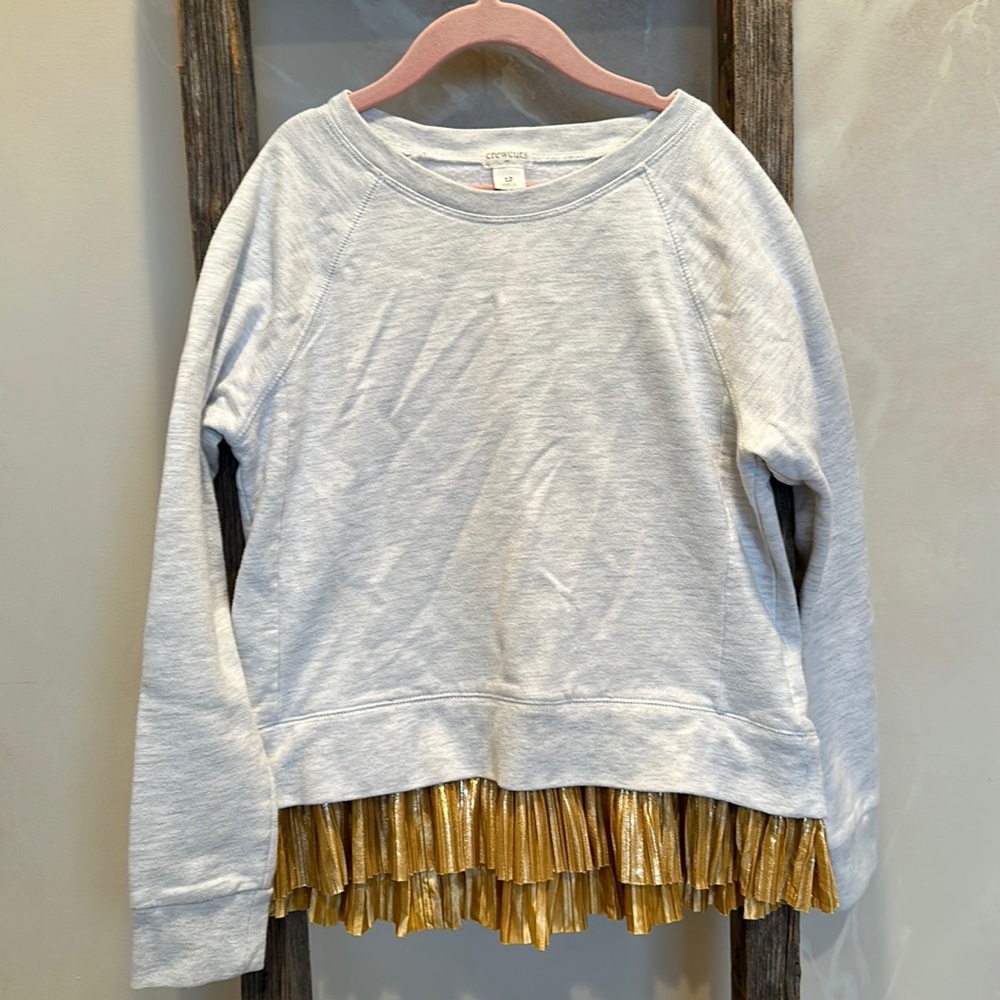Light gray sweatshirt material. Gold ruffle
